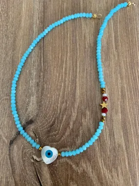 Crystal light blue with mother of pearl heart evil eye